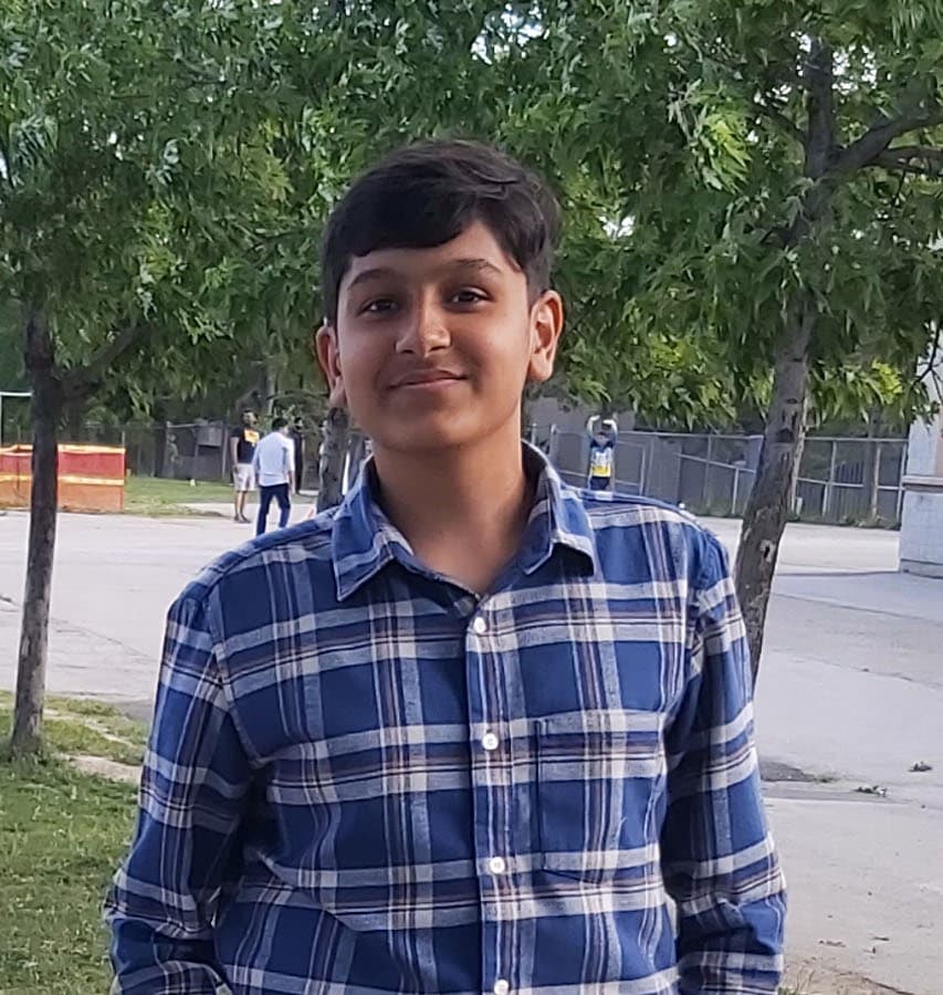 Adil Mukhi smiling outdoors