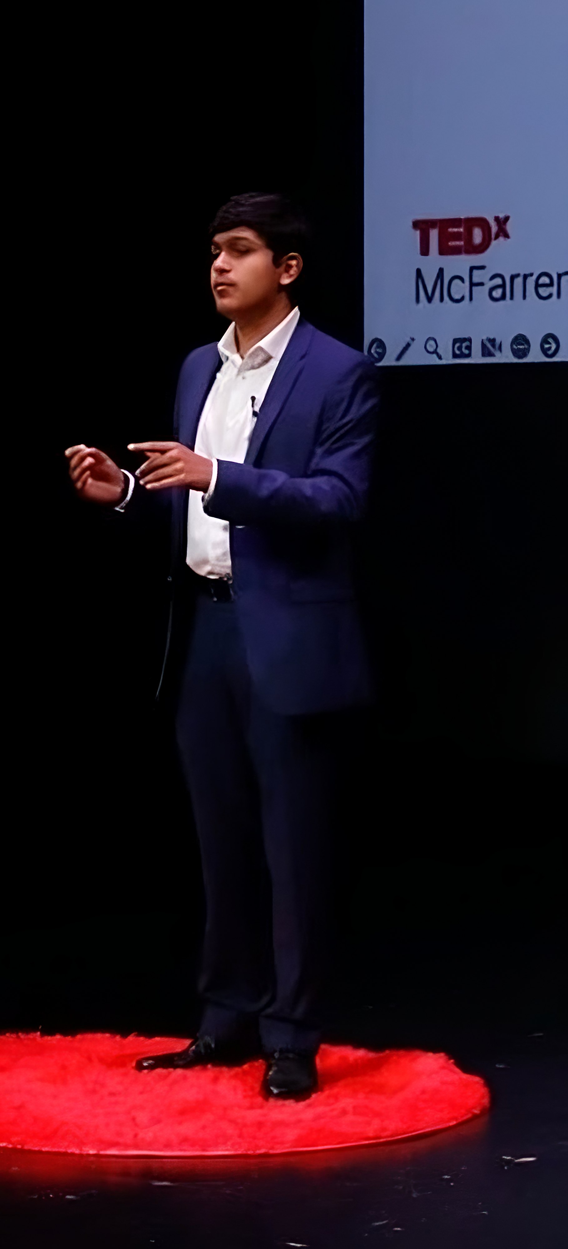 Adil Mukhi speaking at TEDxMcFarren