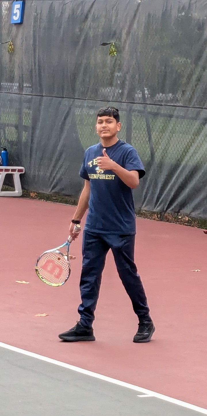 Adil Mukhi playing tennis